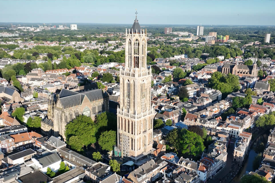 Drone view of the Dom Tower rising above the historic city centre of Utrecht