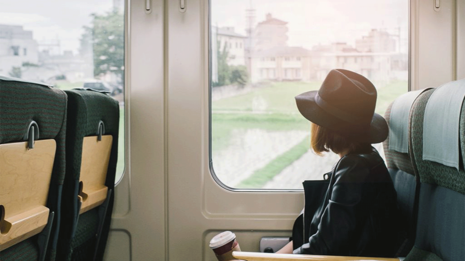 woman-train-coffee-cup