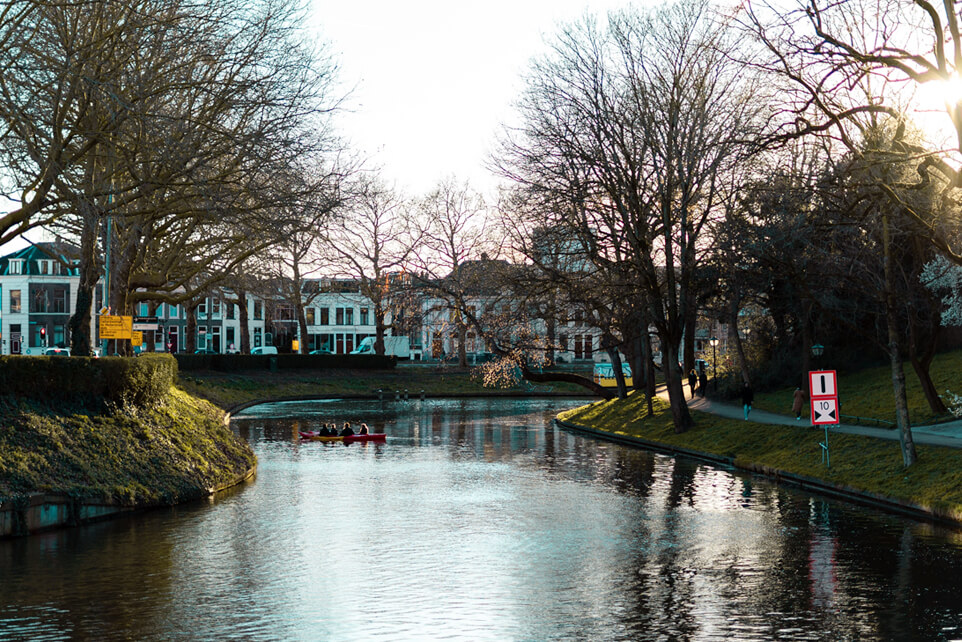 View of the Stadsbuitengracht canal in Utrecht, lined with trees and walking paths.