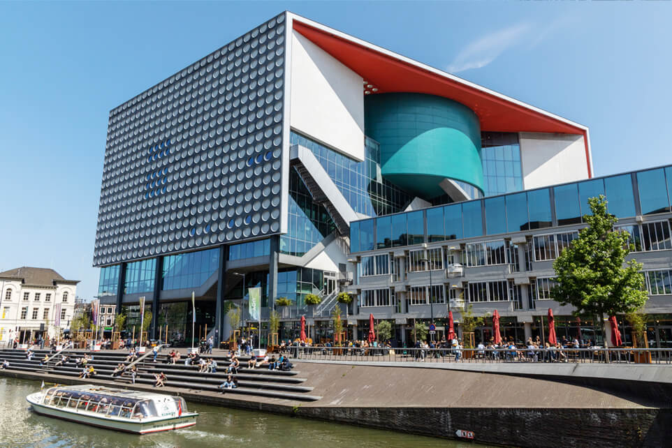 Photo of TivoliVredenburg in Utrecht on a sunny day, showcasing its modern architecture.