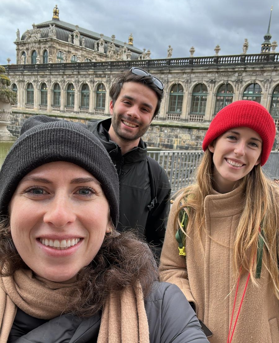A selfie of three people in front of a stately palace in Dresden, Germany