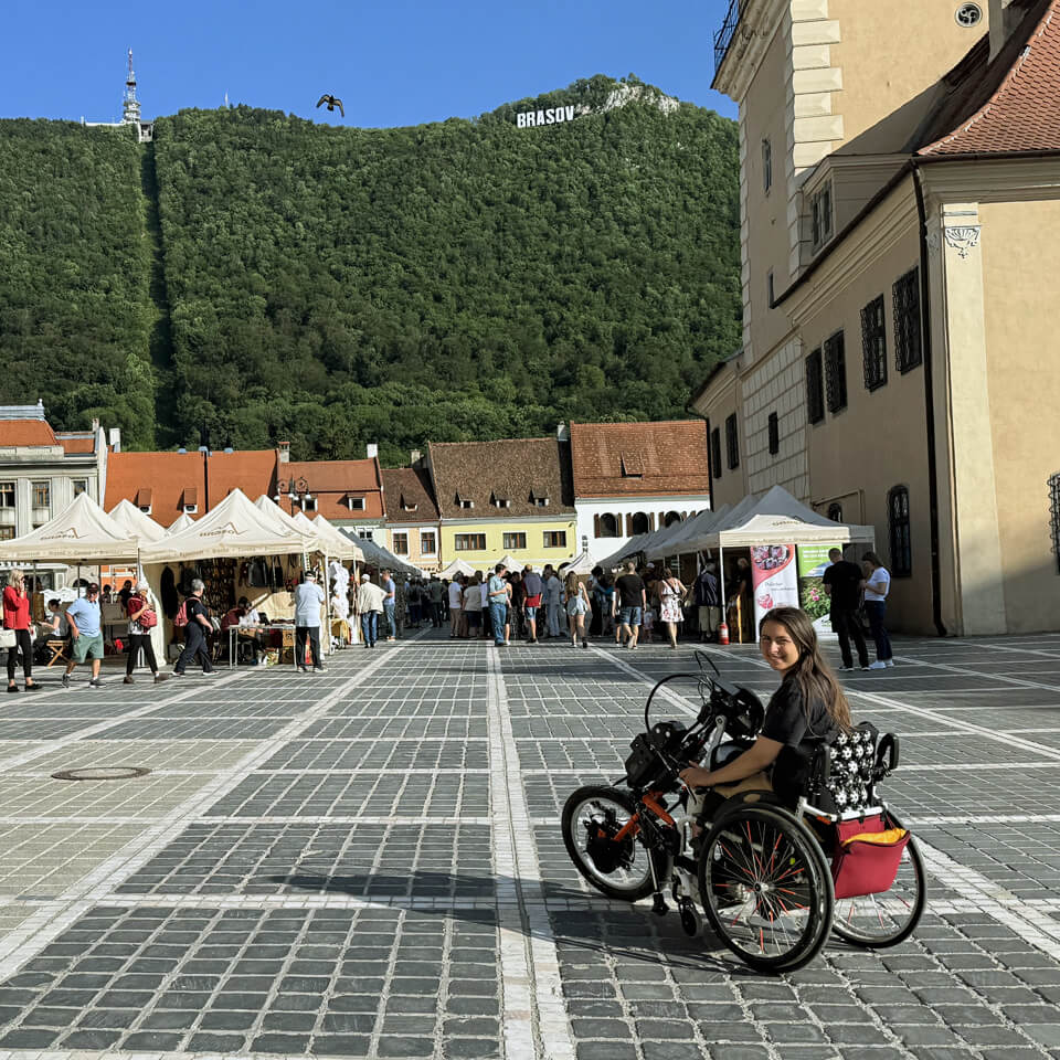 Katie smiles in a square in Romania